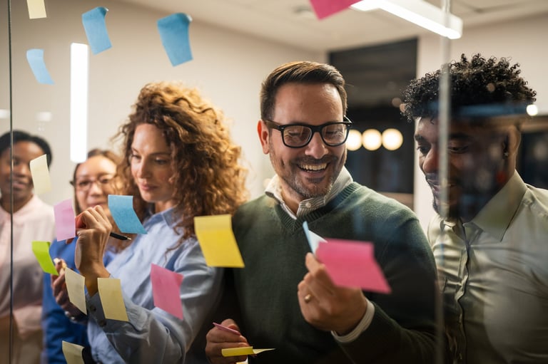 Diverse business professionals collaborating on a strategic plan in modern office